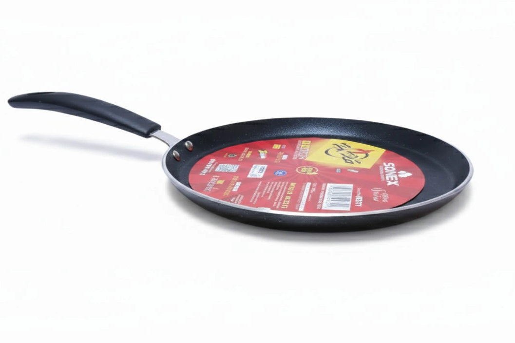 Black frying pan with a red label on a white background