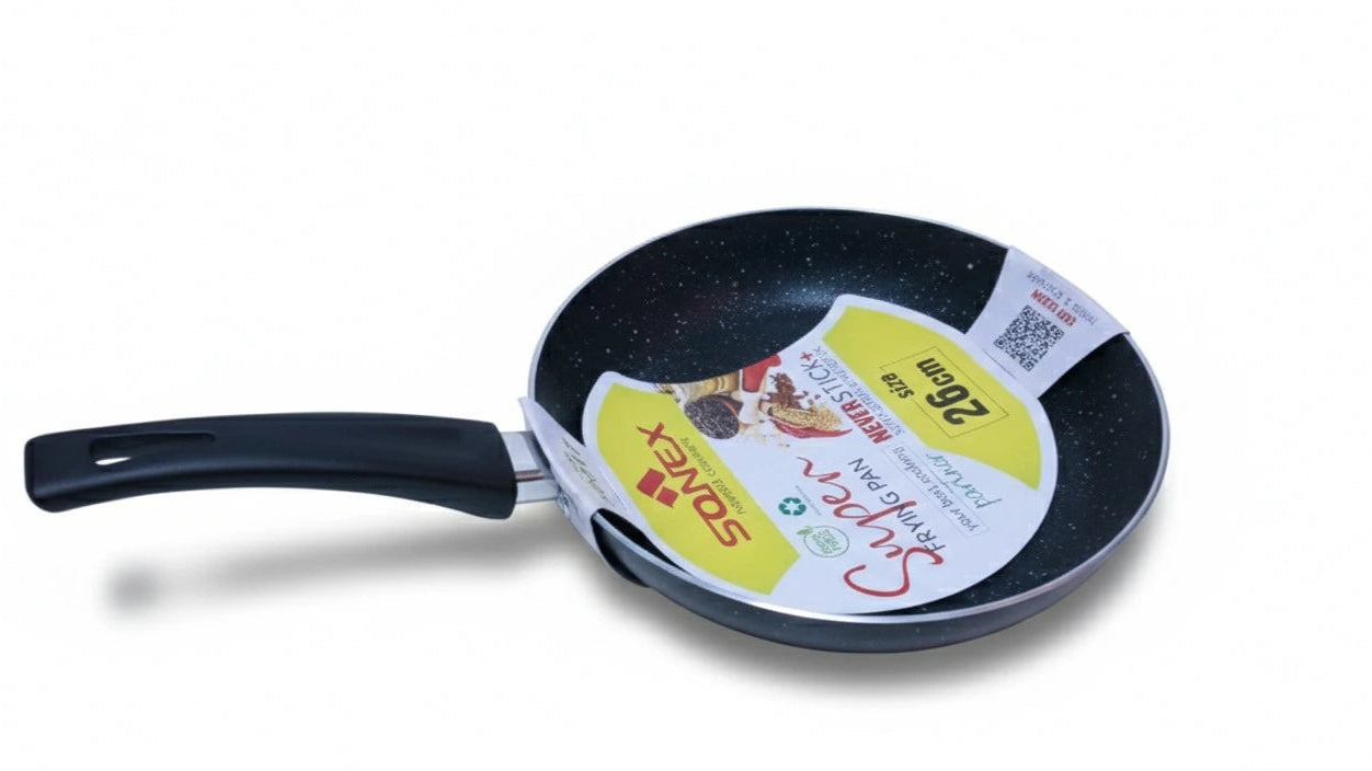 Black frying pan with a label on a white background