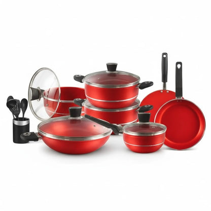 Red cookware set with lids and utensils on a white background