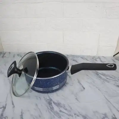 Blue speckled cookware set with a lid on a marble surface