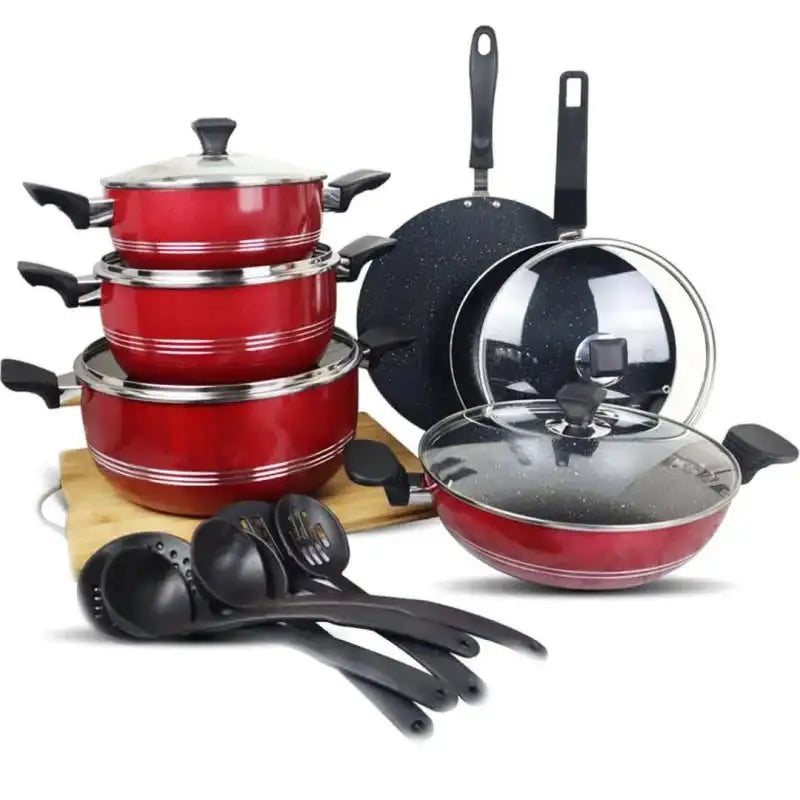 Set of red cookware with black lids and handles on a white background