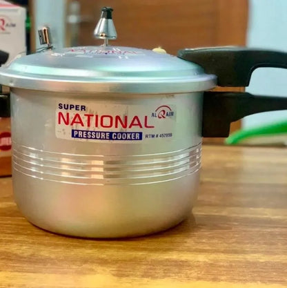 Super National pressure cooker on a wooden surface